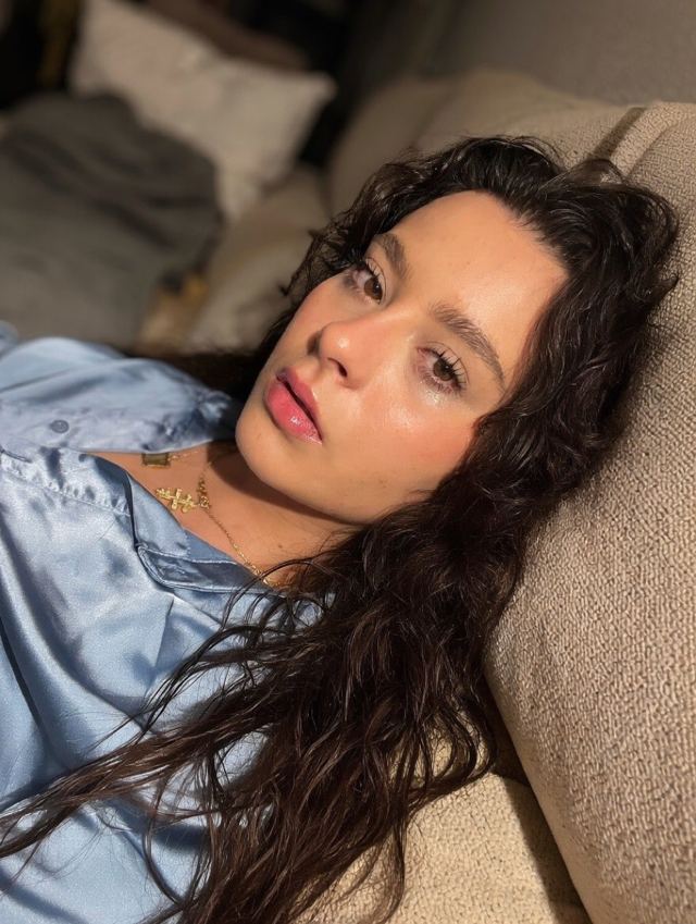 Martina in a blue satin shirt